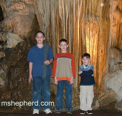 Boys at the cavern entrance
